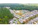 Aerial view of a neighborhood with a pool and tennis courts at 144 Crestbrook Way, Dallas, GA 30157