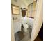 Clean bathroom with a toilet, sink, and shower at 6441 Dunmoor Dr, Jonesboro, GA 30236