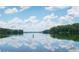 Scenic lake view with lush trees and a tranquil atmosphere at 328 Willow Cv, Canton, GA 30114