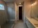 Modern bathroom featuring double vanity and a large walk-in shower at 328 Willow Cv, Canton, GA 30114