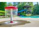 Community pool with mushroom water feature and waterslide at 328 Willow Cv, Canton, GA 30114