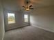 Large main bedroom with carpeted floors and two windows at 328 Willow Cv, Canton, GA 30114
