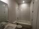 Clean bathroom with a bathtub, shower, and white tile at 328 Willow Cv, Canton, GA 30114