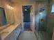 Elegant bathroom with double vanity, large shower, and bedroom view at 328 Willow Cv, Canton, GA 30114