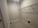 Laundry room with wire shelving and a utility sink at 328 Willow Cv, Canton, GA 30114