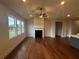 Living room featuring hardwood floors, fireplace and ceiling fan at 328 Willow Cv, Canton, GA 30114