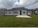 Two-story house with backyard patio and grassy lawn at 328 Willow Cv, Canton, GA 30114