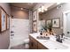 Modern bathroom with a double vanity, bathtub, and shower at 123 Henley St, Canton, GA 30114