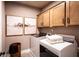 Convenient laundry room with upper cabinets and modern washer/dryer set at 119 Henley St, Canton, GA 30114