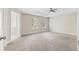 Large bedroom with carpet flooring and two windows at 1125 Reunion Sw Pl, Atlanta, GA 30331