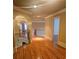 Elegant hallway with hardwood floors and wrought iron railing at 1175 Bowerie Chase, Powder Springs, GA 30127
