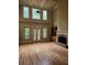 Large living room with hardwood floors, fireplace and high ceilings at 1175 Bowerie Chase, Powder Springs, GA 30127