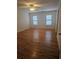 Hardwood floors and plantation shutters in this bright bedroom at 1175 Bowerie Chase, Powder Springs, GA 30127