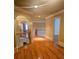 Spacious upper hallway with hardwood floors and wrought iron railings at 1175 Bowerie Chase, Powder Springs, GA 30127