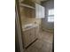 Convenient laundry room with cabinets and a built-in sink at 1175 Bowerie Chase, Powder Springs, GA 30127