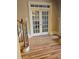 Hardwood floors and French doors leading to formal dining area at 1175 Bowerie Chase, Powder Springs, GA 30127