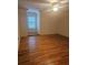 Bright bedroom featuring hardwood floors and a ceiling fan at 1175 Bowerie Chase, Powder Springs, GA 30127