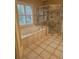Elegant bathroom with soaking tub, walk-in shower, and tile floors at 1175 Bowerie Chase, Powder Springs, GA 30127