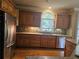 Kitchen with stainless steel appliances and wood cabinets at 1175 Bowerie Chase, Powder Springs, GA 30127