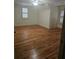 Hardwood floor bedroom with plantation shutters and a ceiling fan at 1175 Bowerie Chase, Powder Springs, GA 30127
