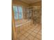 Bathroom with a soaking tub and walk-in shower at 1175 Bowerie Chase, Powder Springs, GA 30127