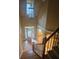 Grand entryway with hardwood floors, staircase, and chandelier at 1175 Bowerie Chase, Powder Springs, GA 30127