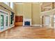 Spacious living room with hardwood floors, fireplace, and built-in shelving at 1175 Bowerie Chase, Powder Springs, GA 30127