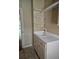Laundry room with utility sink and storage shelves at 1175 Bowerie Chase, Powder Springs, GA 30127