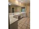 Double vanity bathroom with quartz countertop and tile floors at 1175 Bowerie Chase, Powder Springs, GA 30127