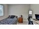 Bright bedroom with a queen bed, built-in closet, and a workspace at 1824 Guardian Way, Lawrenceville, GA 30043