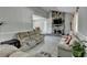 Living room with stone fireplace, tiled floors, and neutral color palette at 1824 Guardian Way, Lawrenceville, GA 30043