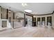 Open living area with hardwood floors and a modern staircase at 115 Wilkins Rd, Fayetteville, GA 30214