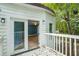 Deck with view into a blue-walled room at 115 Wilkins Rd, Fayetteville, GA 30214