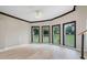 Bright living room with hardwood floors and large windows at 115 Wilkins Rd, Fayetteville, GA 30214