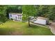 Aerial view of house, yard, and detached garage at 115 Wilkins Rd, Fayetteville, GA 30214