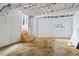 Unfinished basement with concrete floors and exposed beams at 115 Wilkins Rd, Fayetteville, GA 30214