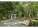 White gazebo nestled in a lush, wooded area at 115 Wilkins Rd, Fayetteville, GA 30214
