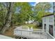 View from deck showcasing backyard, trees, and shed at 115 Wilkins Rd, Fayetteville, GA 30214