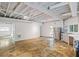 Finished basement with kitchenette and exposed beams at 115 Wilkins Rd, Fayetteville, GA 30214