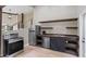 Modern kitchen with stainless steel appliances and open shelving at 115 Wilkins Rd, Fayetteville, GA 30214