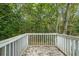 White deck overlooking a wooded backyard at 115 Wilkins Rd, Fayetteville, GA 30214