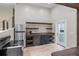 Modern kitchen features stainless steel appliances and wood shelving at 115 Wilkins Rd, Fayetteville, GA 30214