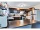 Modern kitchen with stainless steel appliances and dark brown cabinets at 2225 Pleasant Hill Rd, Atlanta, GA 30349