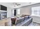 Living room features gray sectional sofa and fireplace at 2225 Pleasant Hill Rd, Atlanta, GA 30349