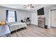 Spacious bedroom with queen bed, desk, and built-in closet at 2225 Pleasant Hill Rd, Atlanta, GA 30349