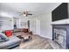 Spacious living room with gray sectional sofa and fireplace at 2225 Pleasant Hill Rd, Atlanta, GA 30349