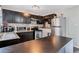 Modern kitchen with stainless steel appliances and dark brown cabinets at 2225 Pleasant Hill Rd, Atlanta, GA 30349