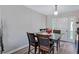 Dining area with table and chairs, and access to the kitchen at 2225 Pleasant Hill Rd, Atlanta, GA 30349
