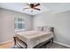 Spacious bedroom with a queen-size bed and ceiling fan at 2225 Pleasant Hill Rd, Atlanta, GA 30349