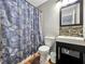 Updated bathroom with a tub/shower and stylish vanity at 2225 Pleasant Hill Rd, Atlanta, GA 30349
